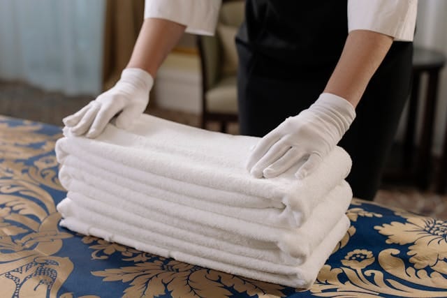 staff folding towels